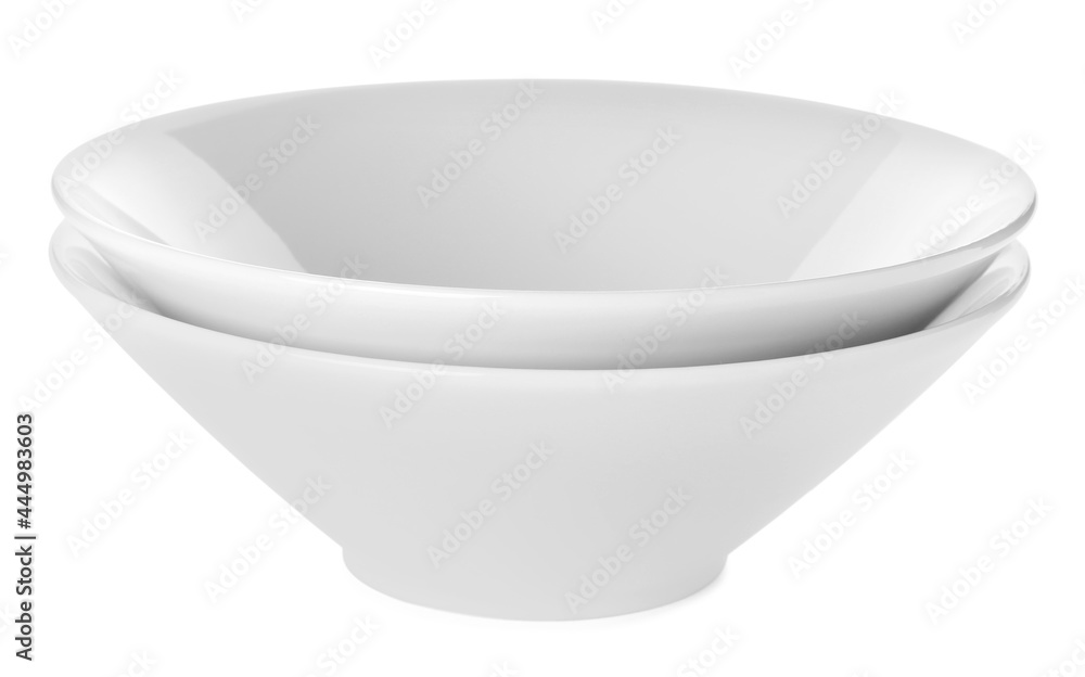 Empty clean ceramic bowls isolated on white Empty clean ceramic bowls isolated on white