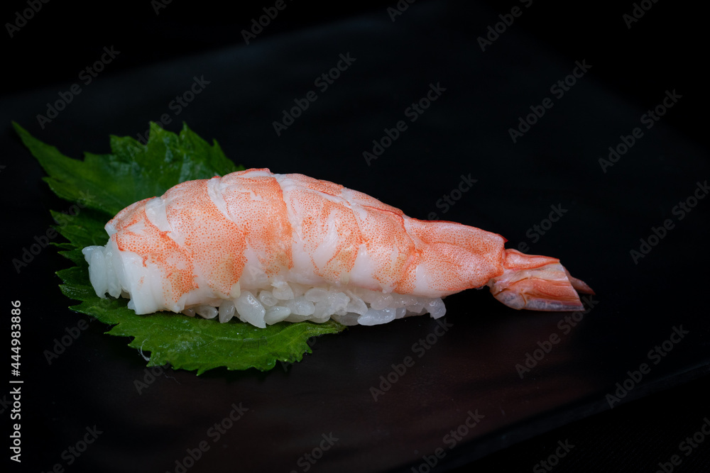 Nigiri sushi with shrimp isolated on black background. Nigiri sushi with shrimp isolated on black background.