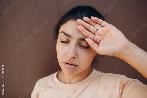 Photography Stressed woman suffering of heatstroke refreshing with cold water outside
