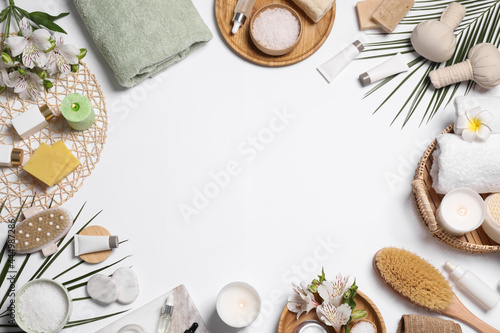 Frame of spa essentials on white background, flat lay. Space for text