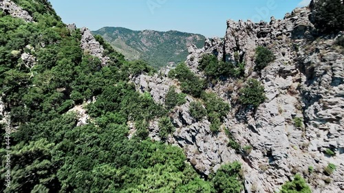 Flight over a cliff in the Turkish bay of Marmaris overlooking the city of Icmeler