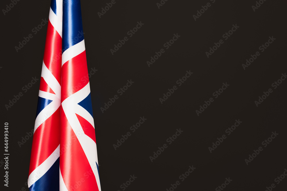 national flag of united kingdom with red cross isolated on black with copy space national flag of united kingdom with red cross isolated on black with copy space