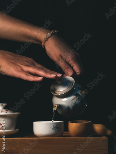 hands pouring tea