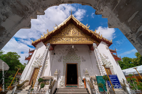 white marble public ancient temple inside arch entrance Wat Phra That Cho Hae, the royal sacred ancient temple in Phrae province, Thailand photo