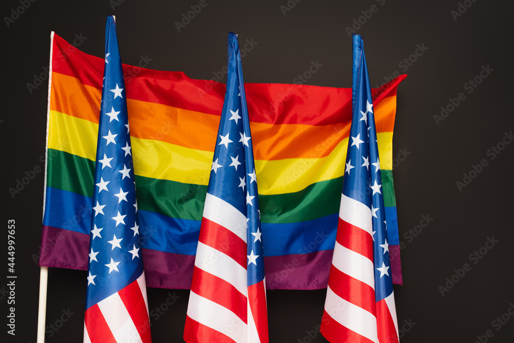 american and colorful lgbt flags isolated on black