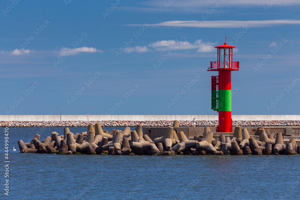 Swinoujscie. Lighthouse on a sunny day against the blue sky. Swinoujscie. Lighthouse on a sunny day against the blue sky.