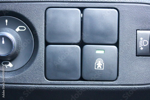 Various buttons in a car, including blanks and child lock © hanjosan