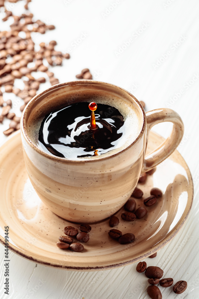 Black coffee and coffee beans. Black coffee and coffee beans.