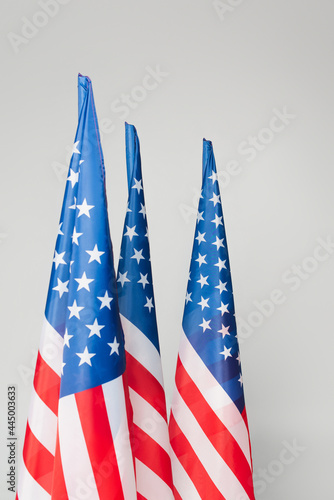 red and blue flags of usa isolated on grey