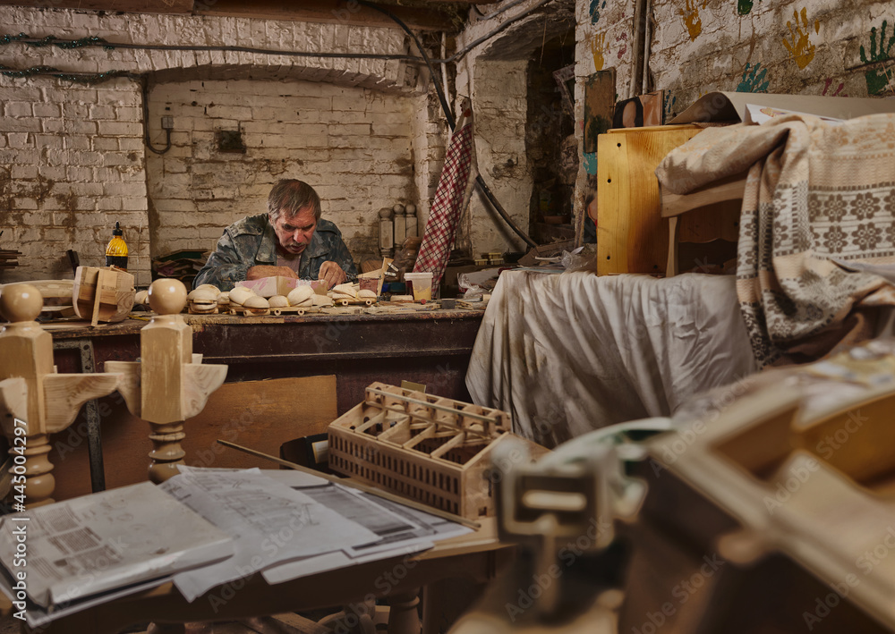 Portrait of carpenter, craftsman in carpentry workshop. Artist at work, hobby like profession