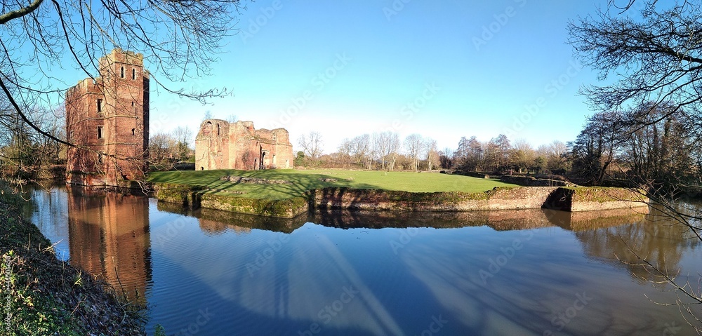 Obraz premium castle and trees near the river