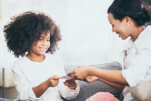 little boy give his mom a c...