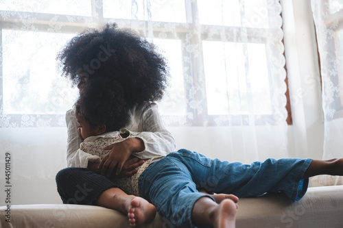 african sibling cuddle eash...