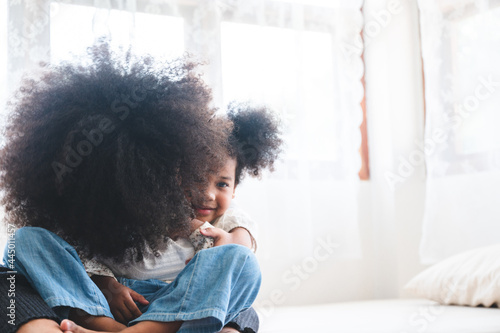 african sibling cuddle eash...