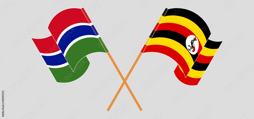 Crossed and waving flags of the Gambia and Uganda Crossed and waving flags of the Gambia and Uganda