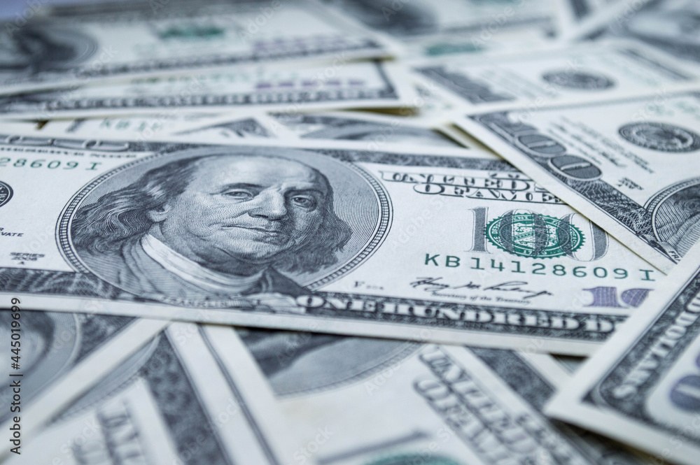 One hundred US dollars banknotes. Cash one hundred dollar bills, 100 dollars, Benjamin Franklin portrait, american currency exchange finance. One hundred US dollars banknotes. Cash one hundred dollar bills, 100 dollars, Benjamin Franklin portrait, american currency exchange finance.