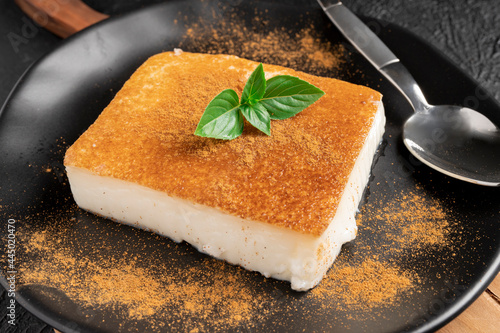 Turkish dessert kazandibi. Caramelized milk pudding with  cinnamon photo