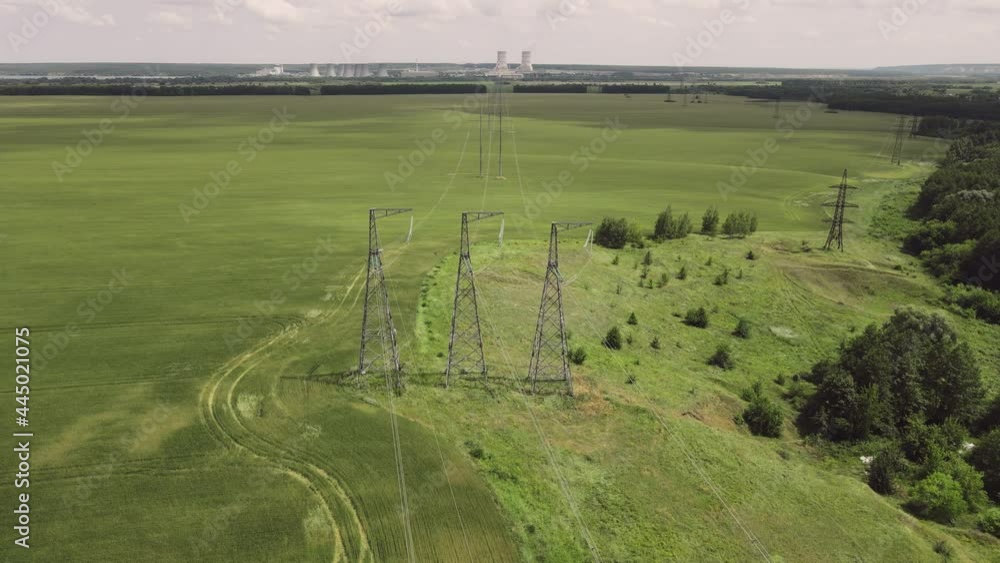 High voltage power line on industrial electricity line tower from