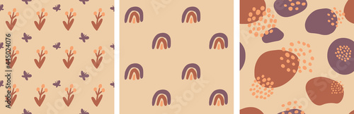 Seamless pattern of colorful autumn leaves, pumpkins, rainbow and acorn on bright background