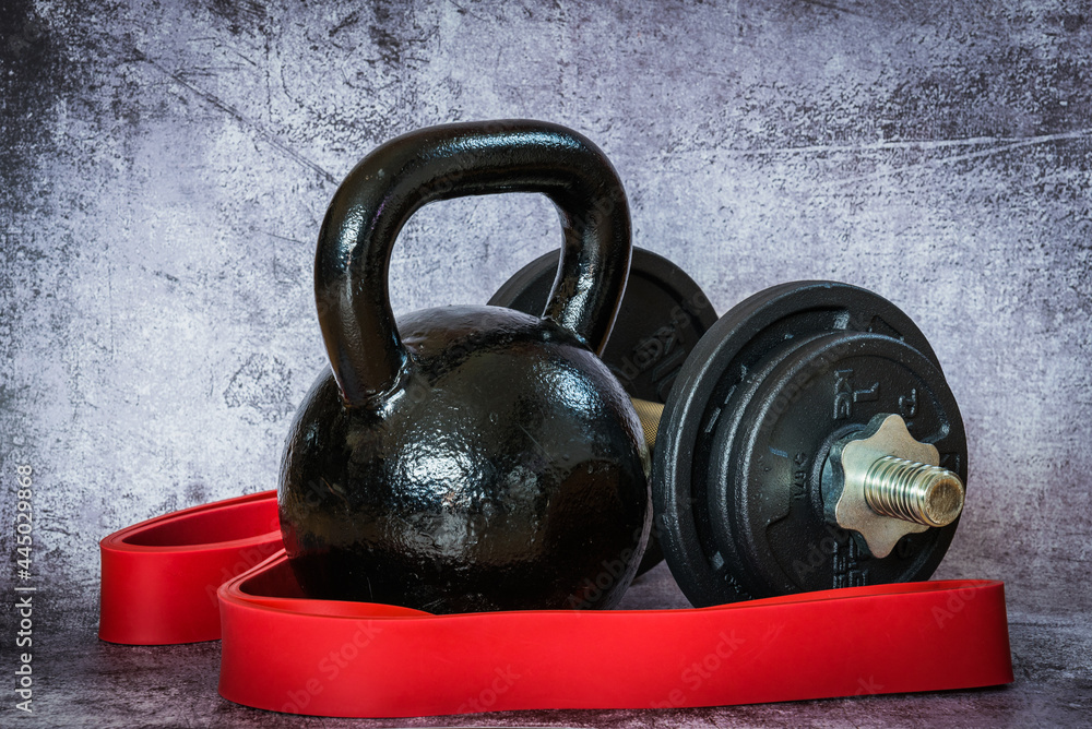 Fototapeta premium dummbells and kettlebell on vintage background