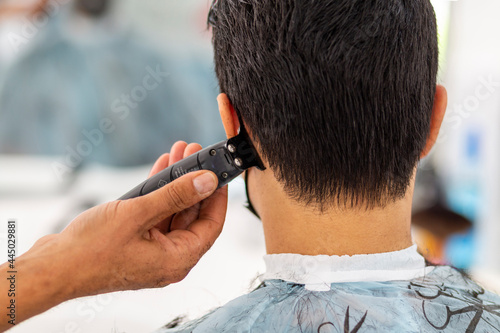 Haircut at a men s barbershop. Haircut with a razor