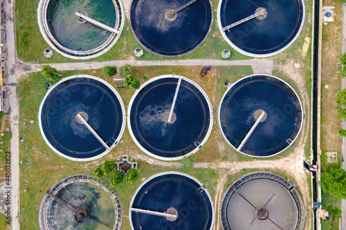Aerial top view of round polls in wastewater treatment plant, filtration of dirty or sewage water