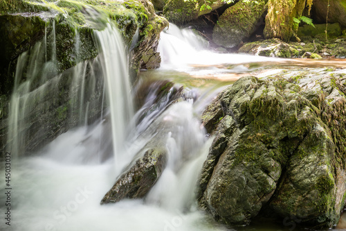 Long exposure of a waterfall on the Hoar Oak Water river at Watersmeet in Exmoor National Park