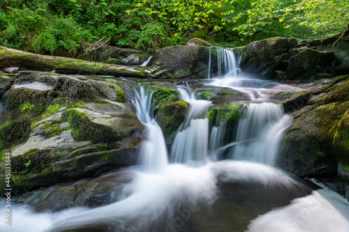 Fototapeta Naklejka Na Ścianę i Meble -  Long exposure of a waterfall on the Hoar Oak Water river at Watersmeet in Exmoor National Park