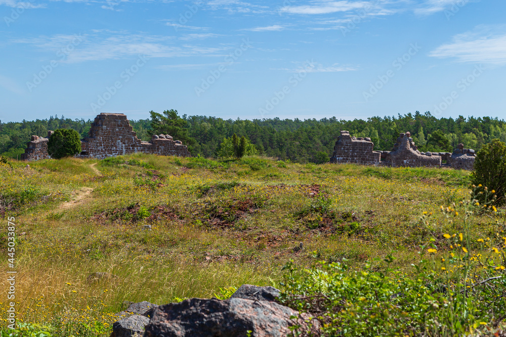 Meadow in front of the ruins of the fortress of Bomarsund in Åland Islands, Finland, on a sunny day in the summer.