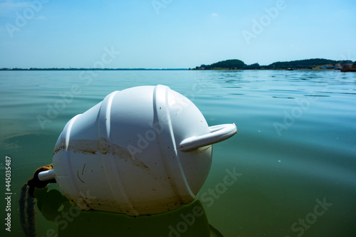 A floating ship buoy near the port, serves as a floating anchor for ships photo