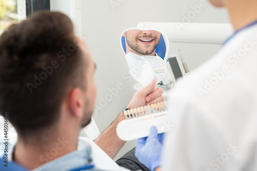 Man in stomatology clinic. Teeth whitening.