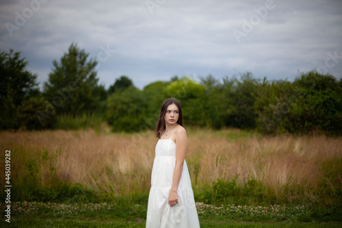 bride in white dress in a field