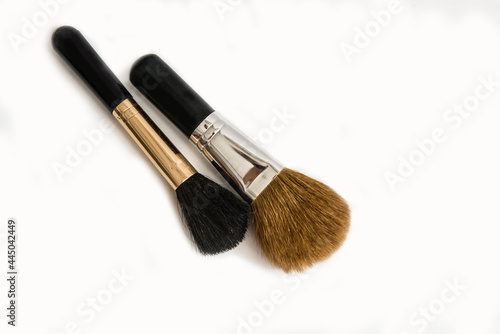 Makeup brushes of different sizes on a white background. Set of brushes for powder. Powder brush set. Cosmetic brush. Cosmetic product.