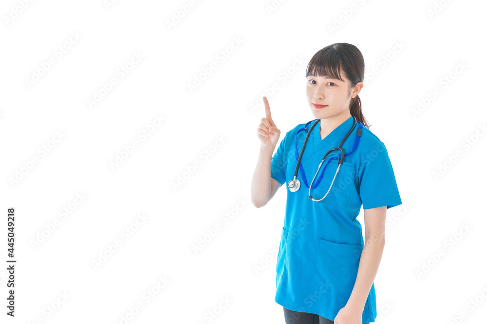指を指す若い女性看護師 指を指す若い女性看護師