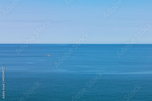 Solo lonely red and white boat cruising on the sea of the south Atlantic Ocean - Punta del Este - Uruguay © Jeferson Dos Santos