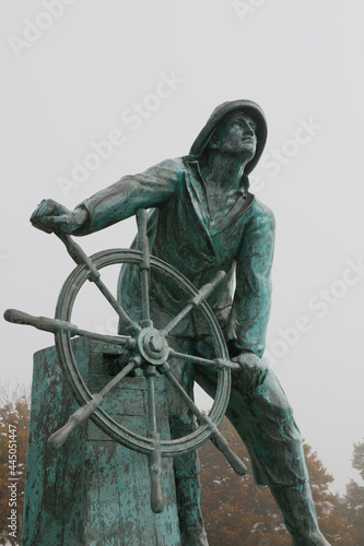the Fisherman's Memorial in Gloucester, Massachusetts on a foggy day.