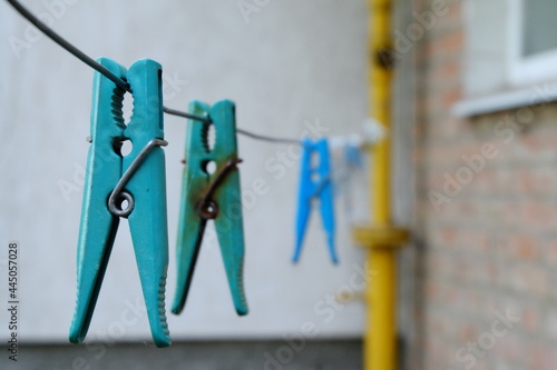 close-up of blue clothespin with metal clip 