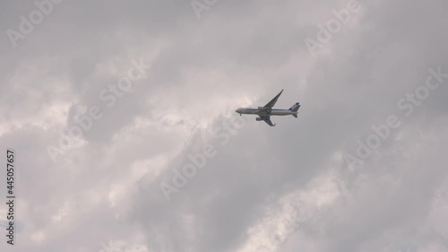 Japanese airplane flying over cloudy sky, Tottori Japan photo
