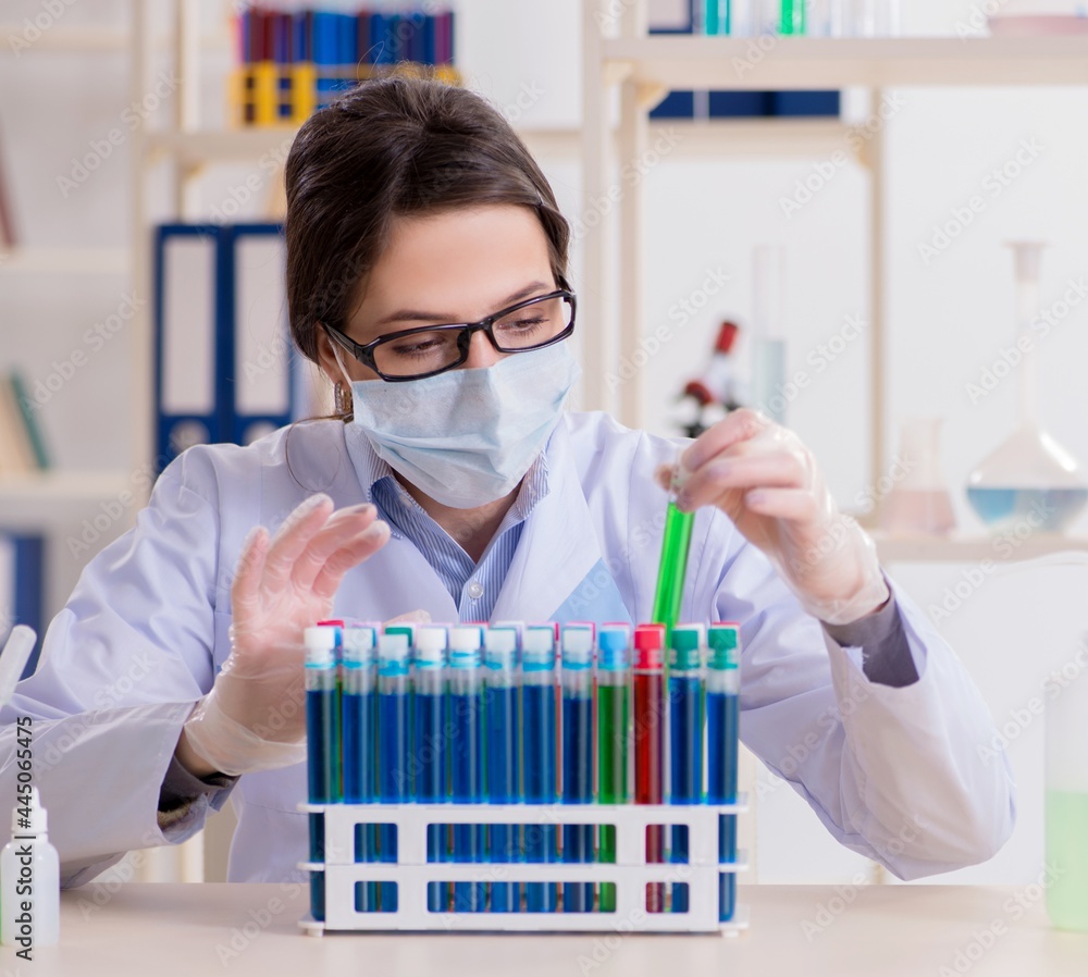 Female chemist working in hospital lab Female chemist working in hospital lab