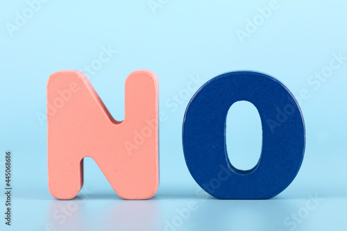 English word NO on blue background photo