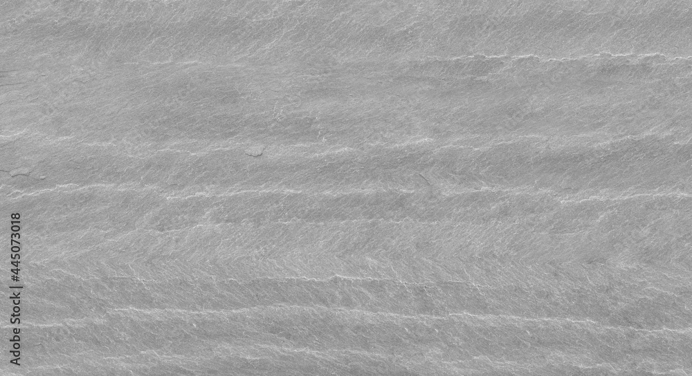 The texture of the stone wall. Close-up. Light gray rock backdrop The texture of the stone wall. Close-up. Light gray rock backdrop