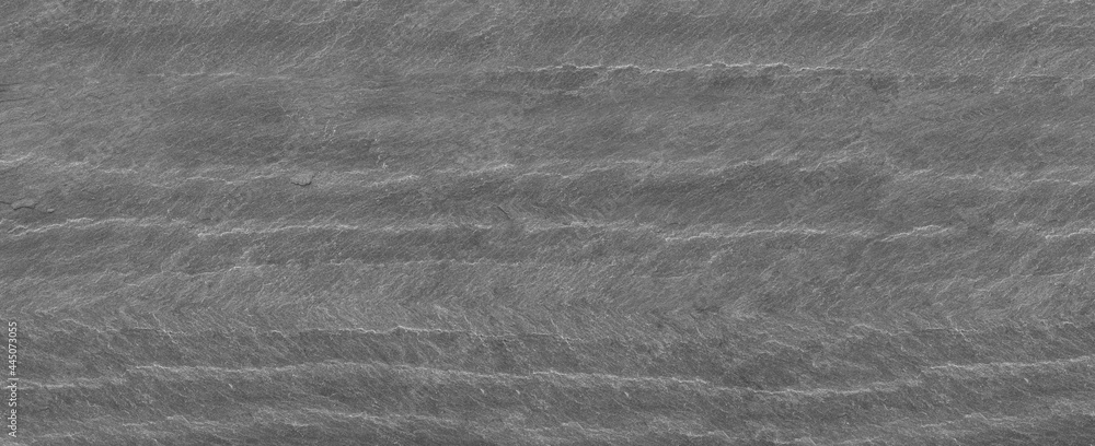 Naklejka premium Panorama dark gray stone background with copy space. Black grunge banner with rock texture. Rock background with cracked surface.