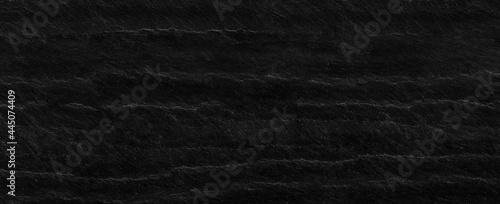 Panorama black rock background. Dark gray stone texture. Black grunge background.