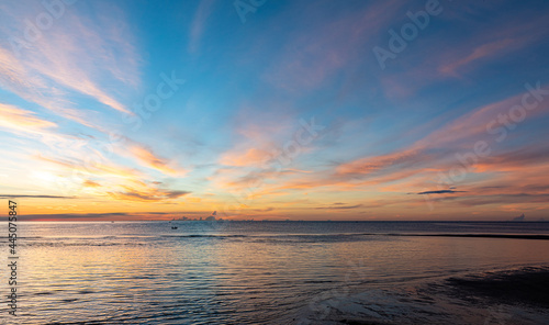 Silhouette at the hun hin beach of thailand on early morning in summer, Beautiful sunset over the sea. © kowitstockphoto