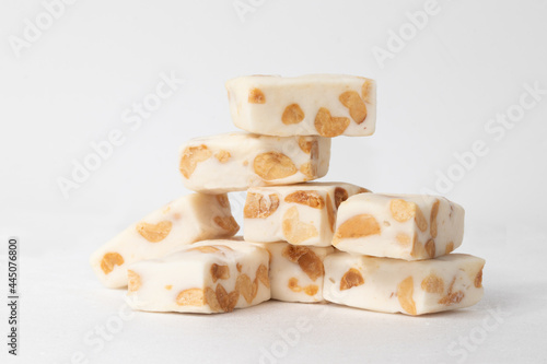 A pile of traditional nougat on white background.