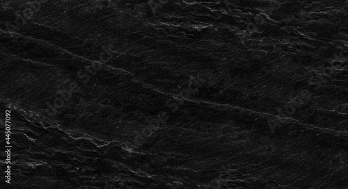Black rock background. Dark gray stone texture. Black grunge background.