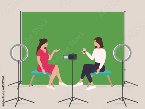 Two womens live streaming show in home studio with professional equipments green screen dslr camera ring light