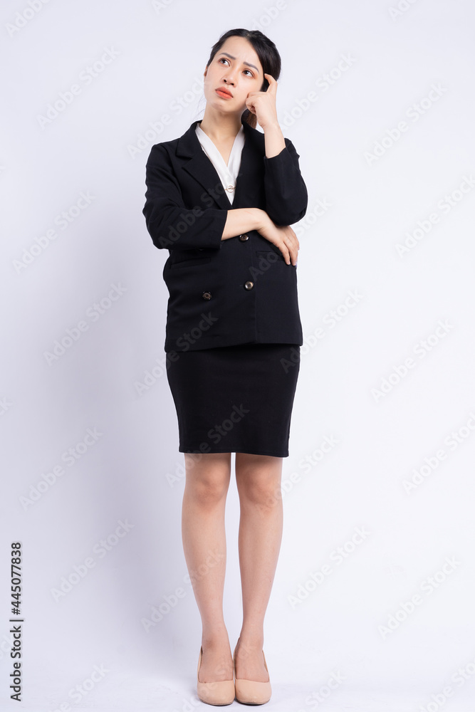 Young Asian businesswoman standing on white background Young Asian businesswoman standing on white background