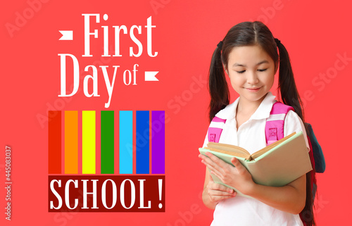 Little schoolgirl with book...