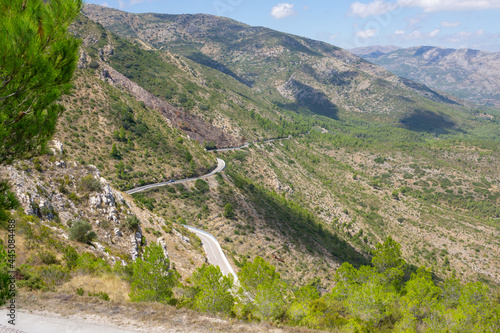 Winding road and agricultural terraces through famous mountain range Coll de Rates